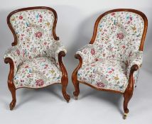 TWO SIMILAR VICTORIAN CARVED MAHOGANY GENT’S EASY ARMCHAIRS, each of typical form with show wood