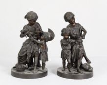 A PAIR OF 19TH CENTURY SPELTER FIGURE GROUPS OF CHILDREN PLAYING, one in roman dress, 11 ¼” (28.5