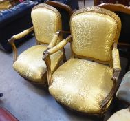 A PAIR OF NINETEENTH CENTURY GOLD COLOURED FRENCH FAUTEUIL OPEN ARMCHAIRS, WITH GOLD ARABESQUE
