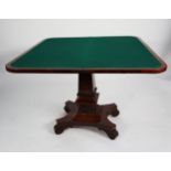 REGENCY STYLE CARVED AND FIGURED MAHOGANY FLAP-TOP CARD TABLE, with ornately carved apron, on square