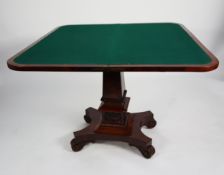 REGENCY STYLE CARVED AND FIGURED MAHOGANY FLAP-TOP CARD TABLE, with ornately carved apron, on square