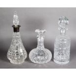 CUT GLASS CONICAL WINE DECANTER with silver neck and spire stopper, London 1914; a CUT GLASS