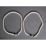 TWO SINGLE STRING CULTURED PEARL CHOKER NECKLACES, one with a clasp marked 'silver', 56g gross