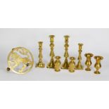 BRASS WARES- TWO GRADUATED PAIRS OF BRASS EJECTOR CANDLESTICKS, 8 ¾” and 7” (22.2cm and 17.8cm)