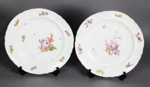 PAIR OF NINETEENTH CENTURY VIENNA PORCELAIN PLATES, each with floral painted centre within a