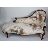 VICTORIAN CARVED WALNUT FRAMED CHAISE LONGUE, the moulded show wood frame enclosing an arched back