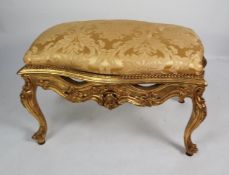 FRENCH STYLE CARVED GILT WOOD LARGE FOOTSTOOL OR SEAT, of serpentine outline with olde gold