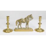 LATE 19th CENTURY BRASS STANDING HORSE DOOR PORTER, depicted with an ornate saddle, 7 1/4in (18.4cm)