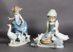 TWO LLADRO PORCELAIN GROUPS OF YOUNG GIRLS WITH WHITE GEESE AND GOSLINGS, one modelled standing, the