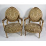 PAIR OF FRENCH STYLE MOULDED GILT WOOD OPEN ARMCHAIRS, each with show wood from enclosing an oval