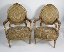 PAIR OF FRENCH STYLE MOULDED GILT WOOD OPEN ARMCHAIRS, each with show wood from enclosing an oval