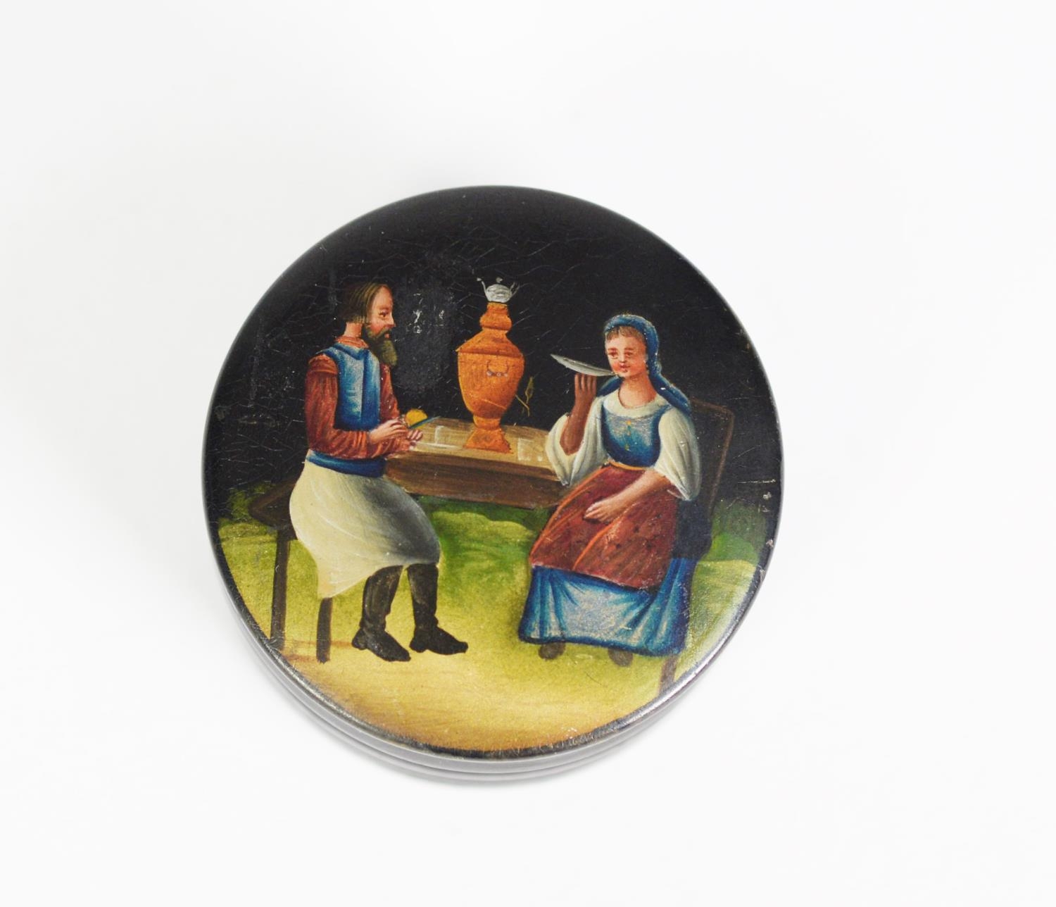 EARLY TWENTIETH CENTURY RUSSIAN BLACK LACQUERED AND PAINTED SMALL CIRCULAR BOX AND COVER, with