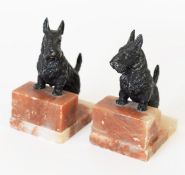 PAIR OF INTER-WAR YEARS JAPANNED SPELTER AND ALABASTER SCOTTIE DOG BOOKENDS, 6 ¼" (16cm) high C/R-