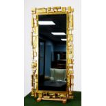 EARLY 1970's AMERICAN 'SYROCO BRUTALIST' GILT PLASTIC FRAMED WALL MIRROR, marked with Copyright date