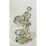 ITALIAN ‘LAMINATO’ CASED SILVER COLOURED METAL FEMALE FIGURAL CANDLE HOLDER, modelled standing