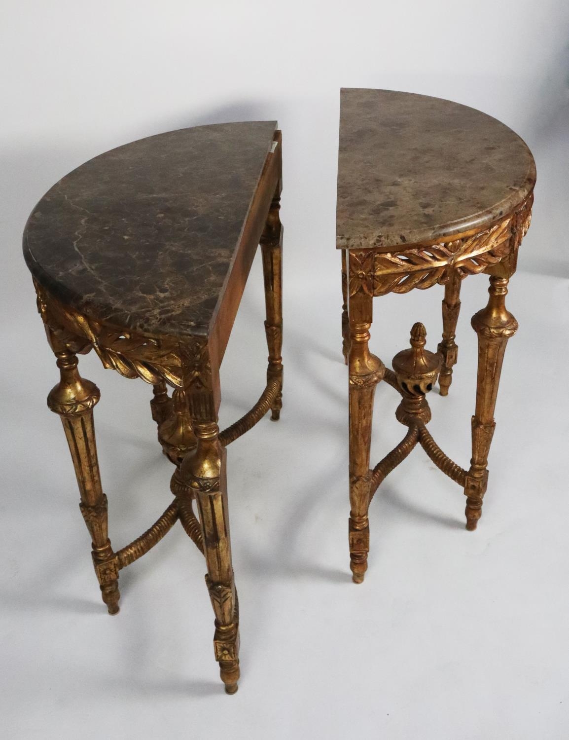 PAIR OF MODERN DARK GREY VEINED MARBLE TOPPED CARVED GILT WOOD DEMI-LUNE SIDE TABLES, each with leaf