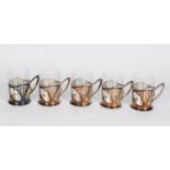 A SET OF FIVE WMF ART NOUVEAU GLASS COFFEE TUMBLERS IN STYLISED METAL CRADLES, each 3 7/8" (10 cm) H