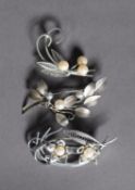 THREE ASSORTED SILVER AND WHITE METAL SPRAY BROOCHES, mounted with pearls, each approx. 5 cm W,