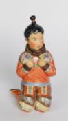 ROYAL COPENHAGEN PORCELAIN FIGURE OF AN ESKIMO GIRL, ‘GREENLAND’, modelled seated holding bunches of