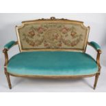 FRENCH STYLE MOULDED GILT WOOD SETTEE, the show wood frame with shaped oblong back open arms with