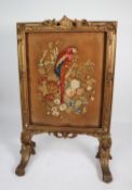 MOULDED GILT WOOD AND GESSO FIRE SCREEN, of picture frame form with woolwork centre depicting a