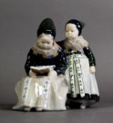 ROYAL COPENHAGEN PORCELAIN FIGURE GROUP OF TWO AMAGER GIRLS READING, model no. 1395, 6 3/4" (17