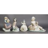 FOUR LLADRO PORCELAIN MODELS OF YOUNG GIRLS WITH FLOWERS, printed marks, 6 ½” (16.5cm) high and