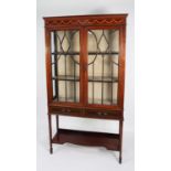 EDWARDIAN INLAID MAHOGANY DISPLAY CABINET, the moulded cornice above a ribbon tied bell flower