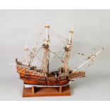 POST-WAR KIT BUILT STAINED AND PAINTED WOOD MODEL OF A THREE-MASTED GALLEON, Santa Maria, two