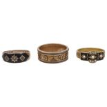 A Victorian 15ct enamel and seed pearl mourning ring and two others