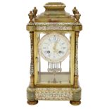 A late 19th century French champleve enamel and brass cased mantle clock