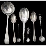 A Georg Jensen silver sugar spoon, a George III Old English pattern sauce ladle and other spoons