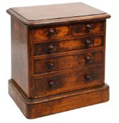 A Victorian mahogany miniature table top chest of drawers