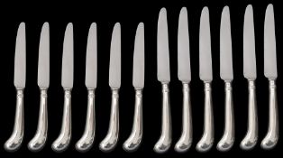 A set of six silver pistol grip handled table and dessert knives, William Comyns and Sons