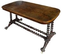 A Victorian walnut stretcher table on barley twist supports