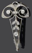 An early 20th century Continental diamond set scroll brooch