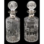 Two modern silver topped crystal decanters and stoppers