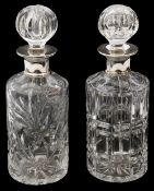 Two modern silver topped crystal decanters and stoppers