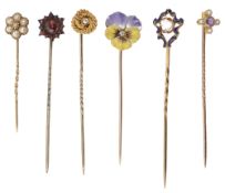 An enamel pansy diamond set stick pin together with five others