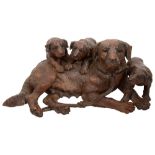 A large and fine late 19th century Swiss Black Forest carved dog group attributed to Walter Mader