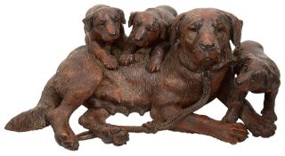 A large and fine late 19th century Swiss Black Forest carved dog group attributed to Walter Mader