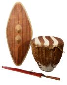 An East African Ganda tribal shield, an East African Maasai sword and a zebra hide drum