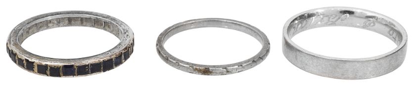 A sapphire full hoop eternity ring together with two wedding bands