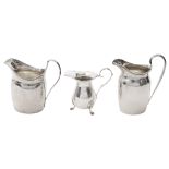 A George III silver cream jug and two others in Georgian style