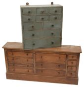 A pine table top bank of drawers and another