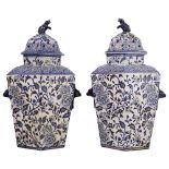 A pair of mid 19th century blue and white pot pourri jars and covers