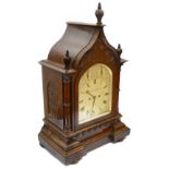 A Victorian Gothic walnut cased bracket clock