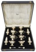 A George V silver twelve piece silver cruet set retailed by Finnigans