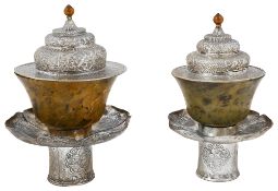 Two Tibetan nephrite jade and white metal stems bowls and covers c.1900