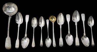 A William IV silver fiddle pattern sauce ladle and a selection of teaspoons